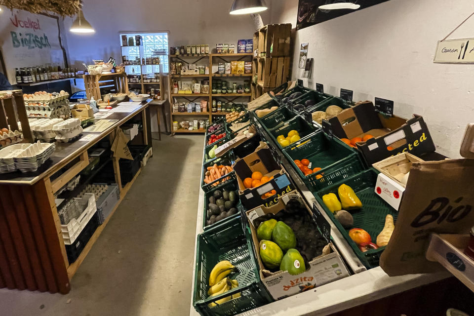 Food is displayed in an organic market in Sprakebuell, Germany, Thursday, March 14, 2024. Sprakebuell is something of a model village for the energy transition - with an above-average number of electric cars, a community wind farm and renewable heat from biogas. All houses in the village center have been connected to the local heating network and all old oil heating systems have been removed. (AP Photo/Frank Molter)