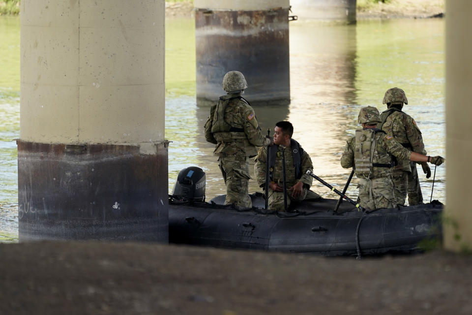 FILE - Texas National Guard help patrol looks the Rio Grande near Eagle Pass, Texas, Friday, Aug. 26, 2022. Texas will build an operations base for up to 1,800 National Guard members in Eagle Pass, expanding the presence of soldiers in the border city where the state has clashed with the Biden administration over immigration enforcement, Republican Gov. Greg Abbott announced Friday, Feb. 16, 2024. (AP Photo/Eric Gay, File)