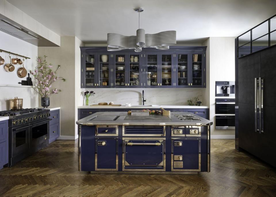 a kitchen with blue cabinets