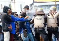 Clashes between demonstrators and officers following a protest against the government's labor reforms in a "jobs creation" bill in Jakarta