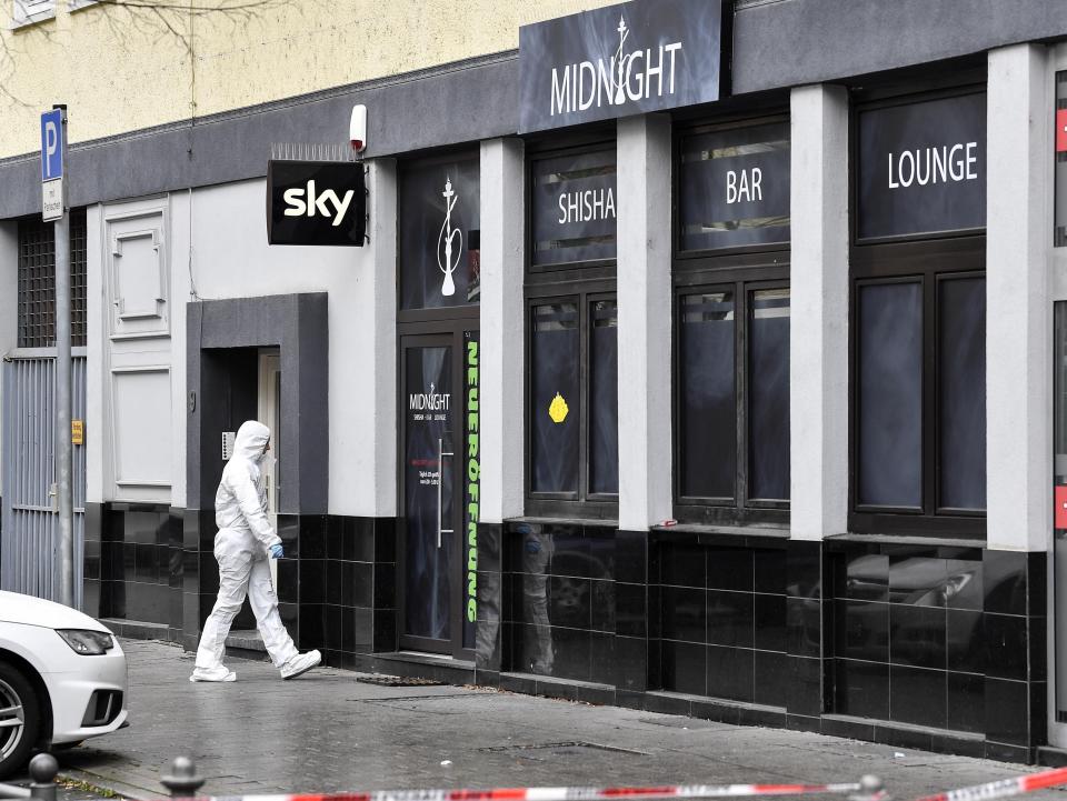 A forensic officer walks into the hookah bar where several people were killed late Wednesday in Hanau, Germany.&nbsp;Turkish nationals are believed to be among the dead. (Photo: ASSOCIATED PRESS)