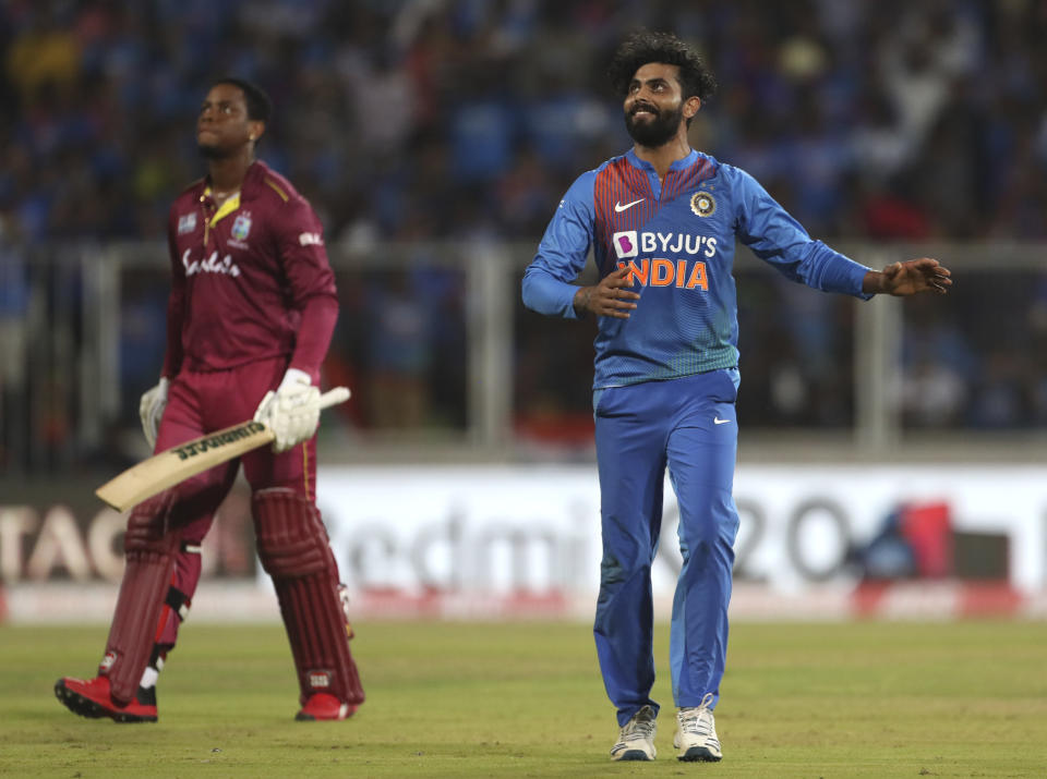 India's Ravindra Jadeja, right, celebrates the dismissal of West Indies' Shimron Hetmyer, left, during the second Twenty20 international cricket match between India and West Indies in Thiruvanathapuram, India, Sunday, Dec. 8, 2019. (AP Photo/Aijaz Rahi)