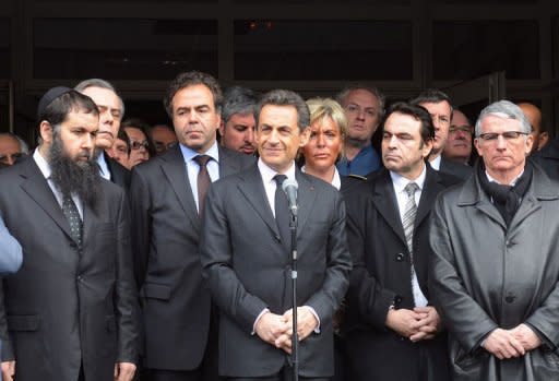France's incumbent President Nicolas Sarkozy (C), speaks in front of the "Ozar Hatorah" Jewish school where four people were shot dead