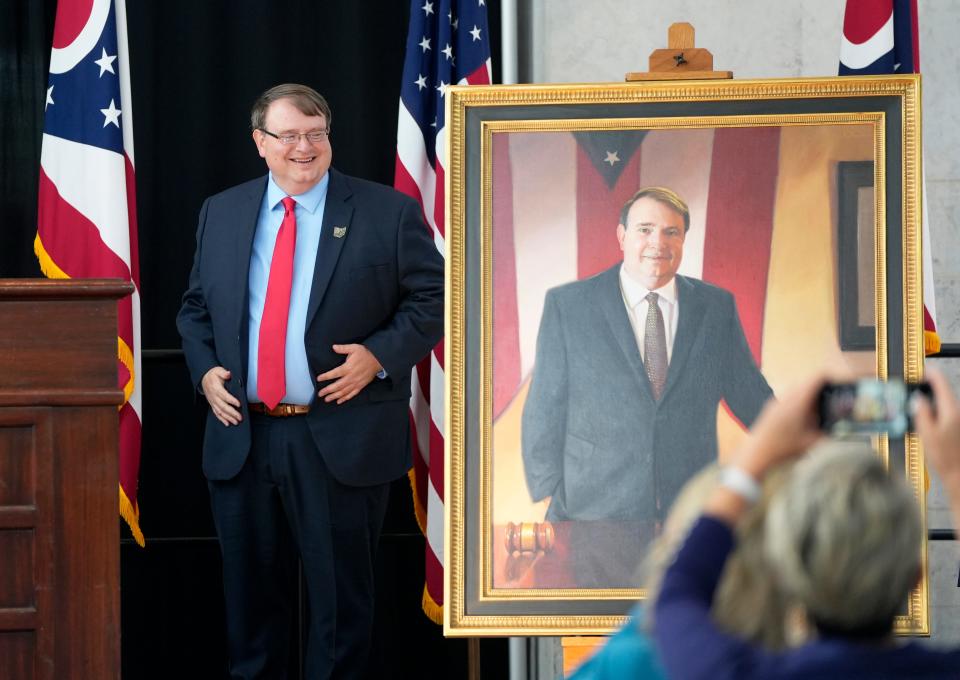 Former Ohio Senate President Larry Obhof stands next to his portrait, which was unveiled in the atrium of the Ohio Statehouse on Wednesday. “It's always great to be a part of history and to have your time serving the people of Ohio remembered," he said.