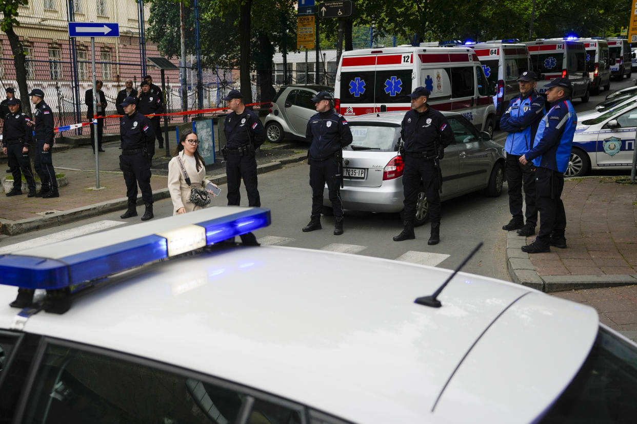 Police block street around the Vladislav Ribnikar school in Belgrade, Serbia, Wednesday, May 3, 2023. A teenage boy opened fire early Wednesday in a school in central Belgrade, causing injuries. (AP Photo/Darko Vojinovic)