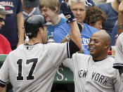 BOSTON, MA - JULY 7: Andruw Jones #22 of the New York Yankees greets Jayson Nix #17 after Nix's home run during the fourth inning of game one of a doubleheader against the Boston Red Sox at Fenway Park on July 7, 2012 in Boston, Massachusetts. (Photo by Winslow Townson/Getty Images)