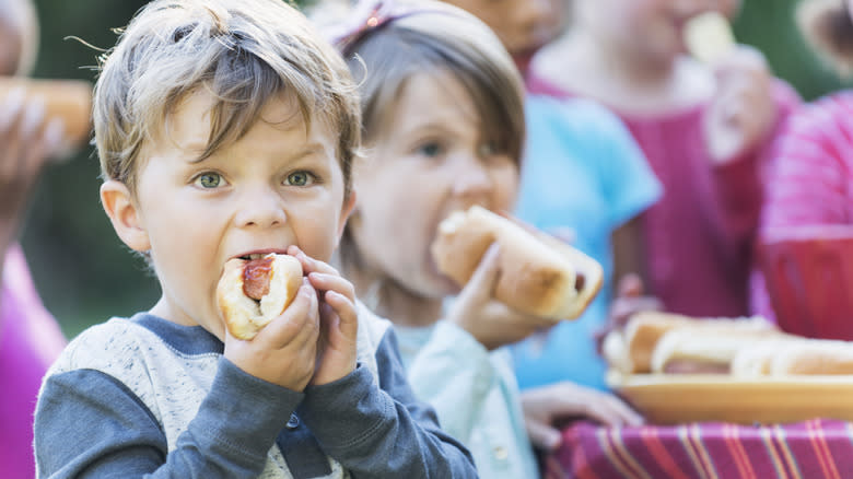 kid eating a hot dog