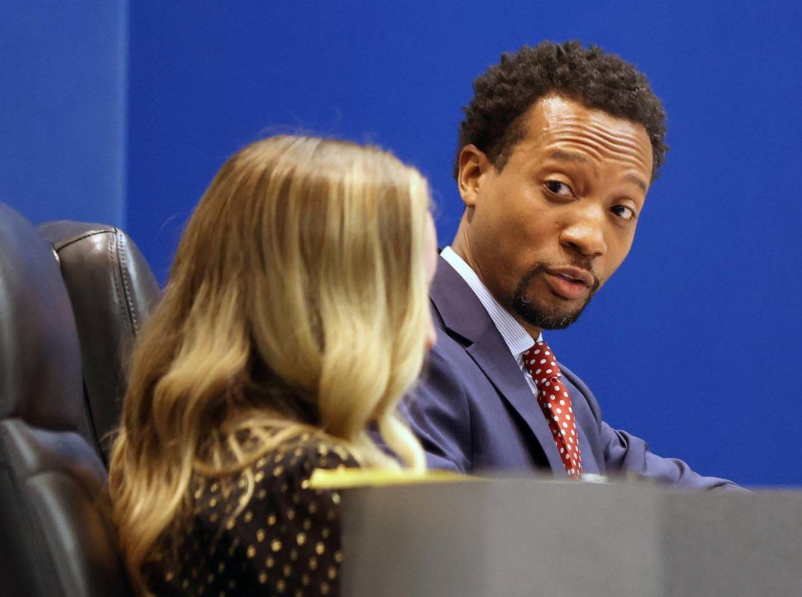 Board member Torey Alston, right, looks toward board member Sarah Leonardi while giving his remarks during the Dec. 13, 2022, Broward School Board meeting.