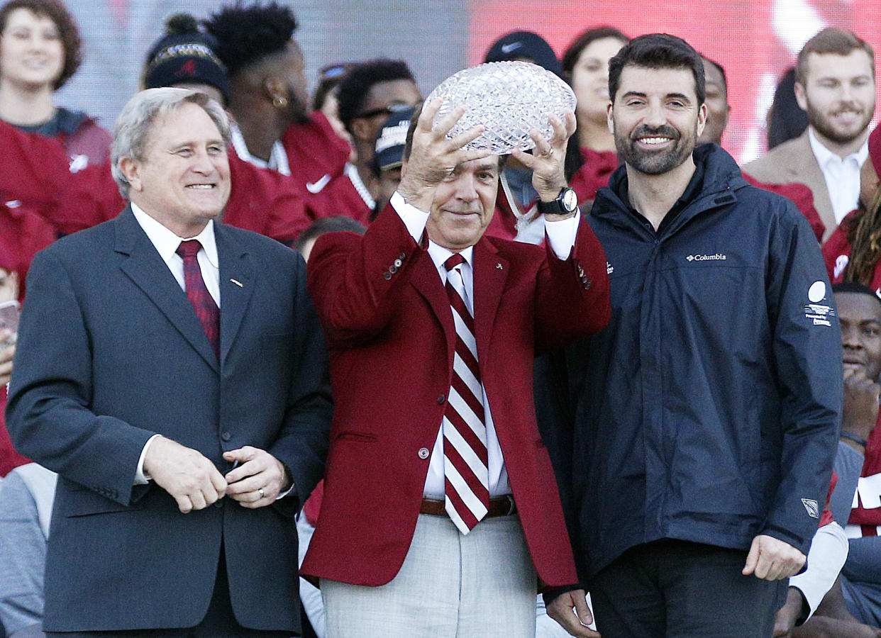 Alabama coach Nick Saban holds up the ‘coaches trophy’ during the NCAA college football national championship celebration, Saturday, Jan. 20, 2018, in Tuscaloosa, Ala. Alabama won the national championship game against Georgia 26-23 in overtime. (AP Photo/Brynn Anderson)