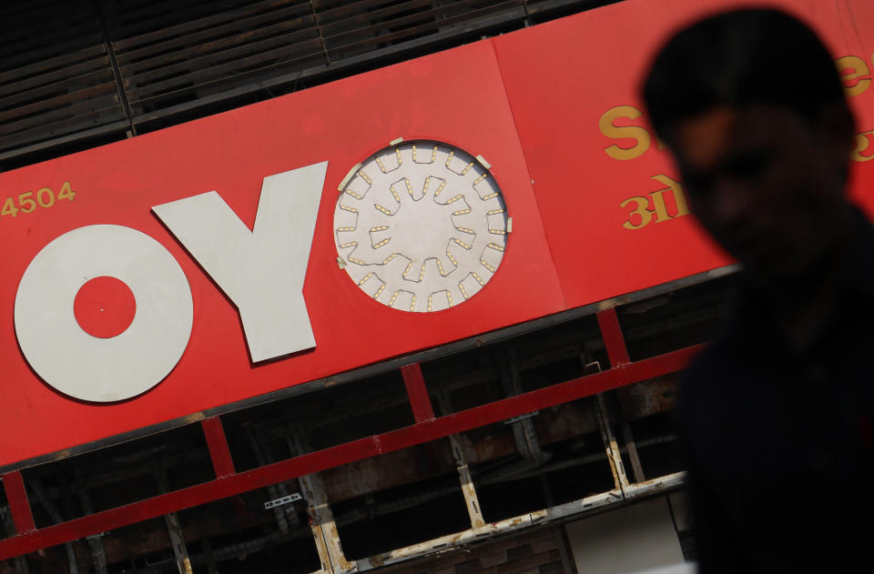 A man walks past a logo of Oyo Rooms on March 09, 2020 in Mumbai, India. (Photo by Himanshu Bhatt/NurPhoto via Getty Images)