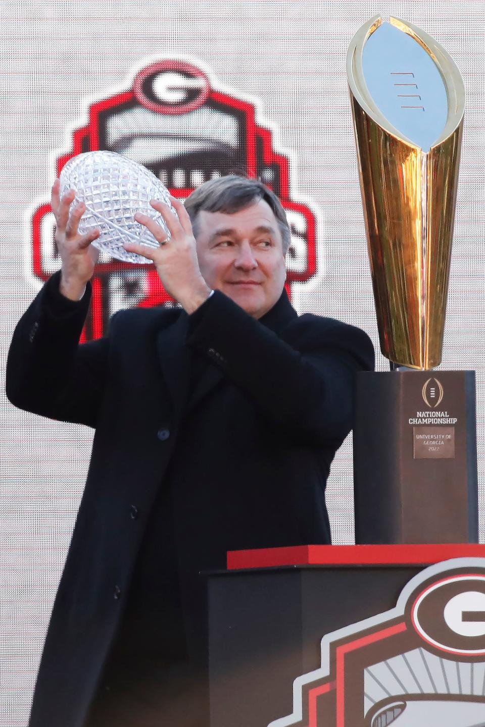 Georgia coach Kirby Smart is presented with the AFCA National Championship Coaches' Trophy during Georgia's back to back National Championship celebration in Athens, Ga., on Saturday, Jan. 14, 2023.