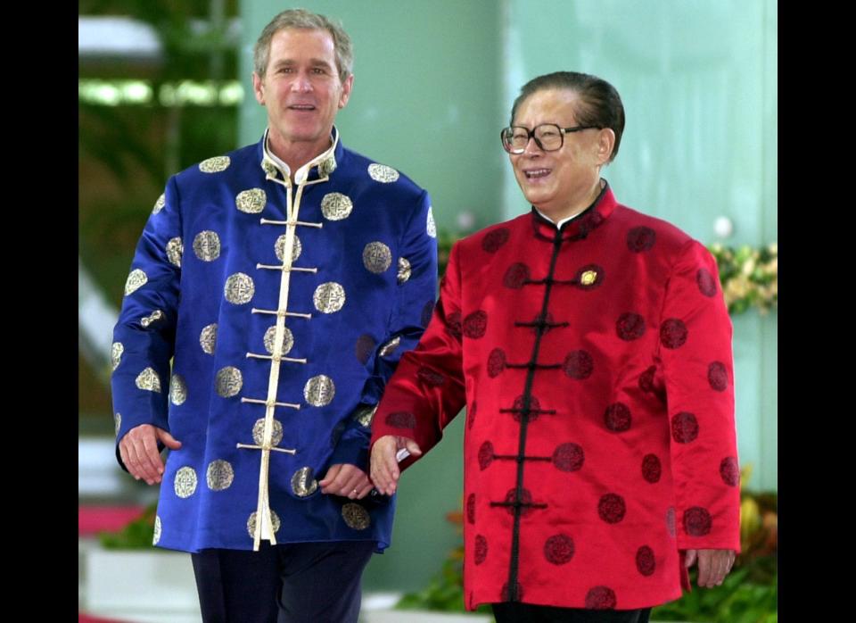 President Bush and Chinese President Jiang Zemin wear traditional style silk jackets as they walk to an informal meeting at the Asia Pacific Economic Cooperation (APEC) leader's summit in Shanghai on Oct. 21, 2001. 