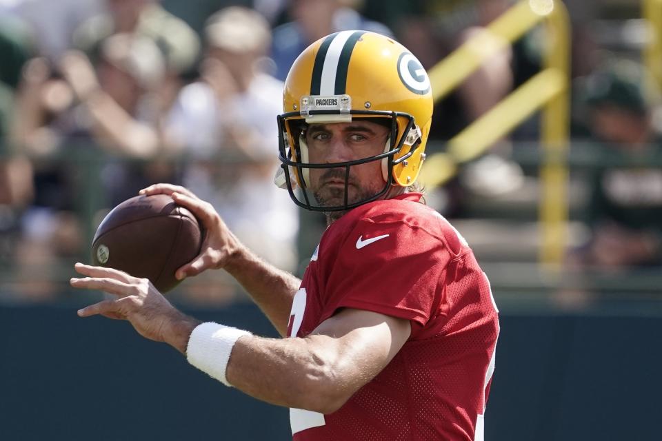 Green Bay Packers' Aaron Rodgers runs a drill before an NFL football joint practice session with the New Orleans Saints Tuesday, Aug. 16, 2022, in Green Bay, Wis. (AP Photo/Morry Gash)