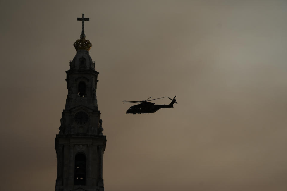 The helicopter carrying Pope Francis arrives at the Catholic holy shrine of Fatima, in central Portugal, to pray the rosary with sick young people, Saturday, Aug. 5, 2023. Francis is in Portugal through the weekend to preside over the 37th World Youth Day, a jamboree that St. John Paul II launched in the 1980s to encourage young Catholics in their faith. (AP Photo/Gregorio Borgia)