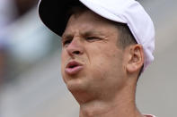 Poland's Hubert Hurkacz blows as he plays Norway's Casper Ruud during their fourth round match of the French Open tennis tournament at the Roland Garros stadium Monday, May 30, 2022 in Paris. (AP Photo/Michel Euler)