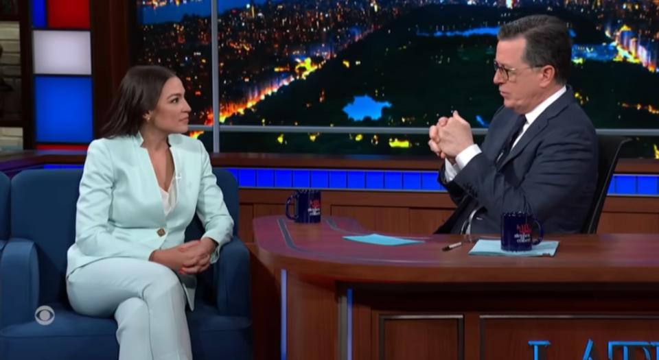 Colbert asked Ocasio-Cortez if she would support President Biden’s re-election campaign. CBS
