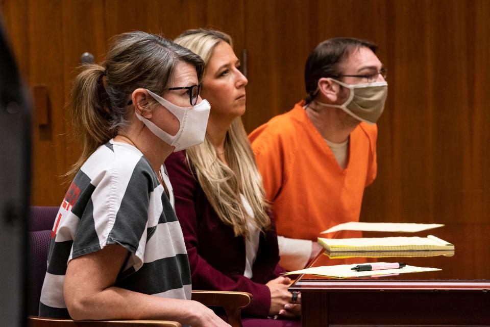 Jennifer Crumbley, sat to the left of attorney Mariell Lehman as her husband, James Crumbley, sat to the right in the Oakland County courtroom of Judge Cheryl Matthews on March 22, 2022.