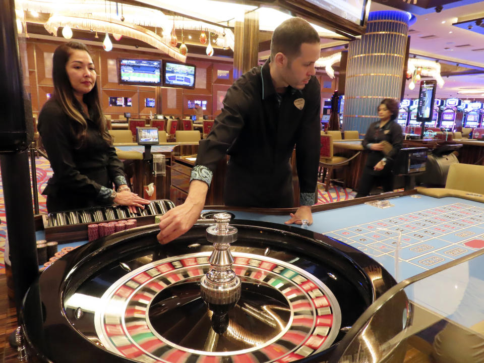 Dealers conduct a game of roulette at the Hard Rock casino in Atlantic City, N.J., on May 17, 2023. All nine Atlantic City casinos turned a profit in the second quarter of this year, although that collective profit was down more than 20% from a year ago. Figures released Tuesday, Aug. 22, by the New Jersey Division of Gaming Enforcement show the casinos posted a gross operating profit of nearly $146 million in the second quarter of this year. (AP Photo/Wayne Parry)