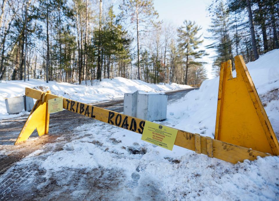 A roadblock is seen along Ross Allen Lane on Wednesday, February 8, 2023, at Lac du Flambeau town hall in Lac du Flambeau, Wis. A special town board meeting was held to receive public comment and deliberate over the town’s course of action in response to Lac du Flambeau reservation tribal officials erecting barricades along four roads in the area. Tribal officials set up barricades on the roads Jan. 30 after negotiations with property title companies that built the roads and the homes they access broke down. Tribal officials say the roads were illegally built on tribal lands and the tribe was not compensated for the right-of-way easements.Tork Mason/USA TODAY NETWORK-Wisconsin 