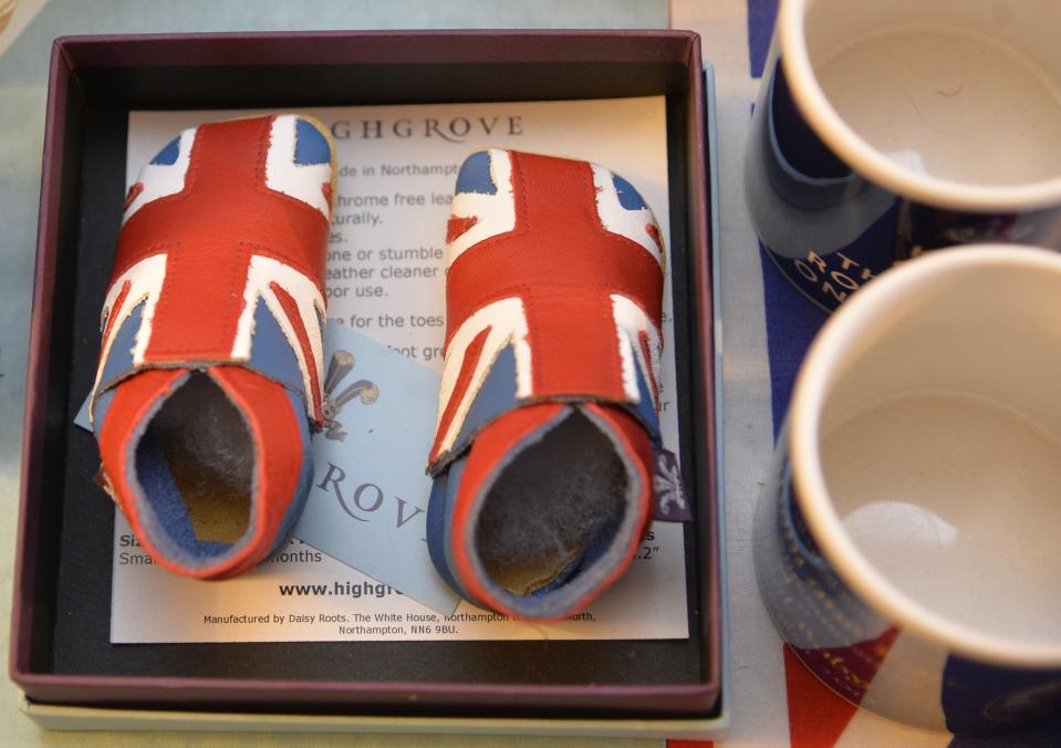 A pair of union flag covered baby boots to celebrate the birth of Prince George are seen at the house of Margaret Tyler in west London