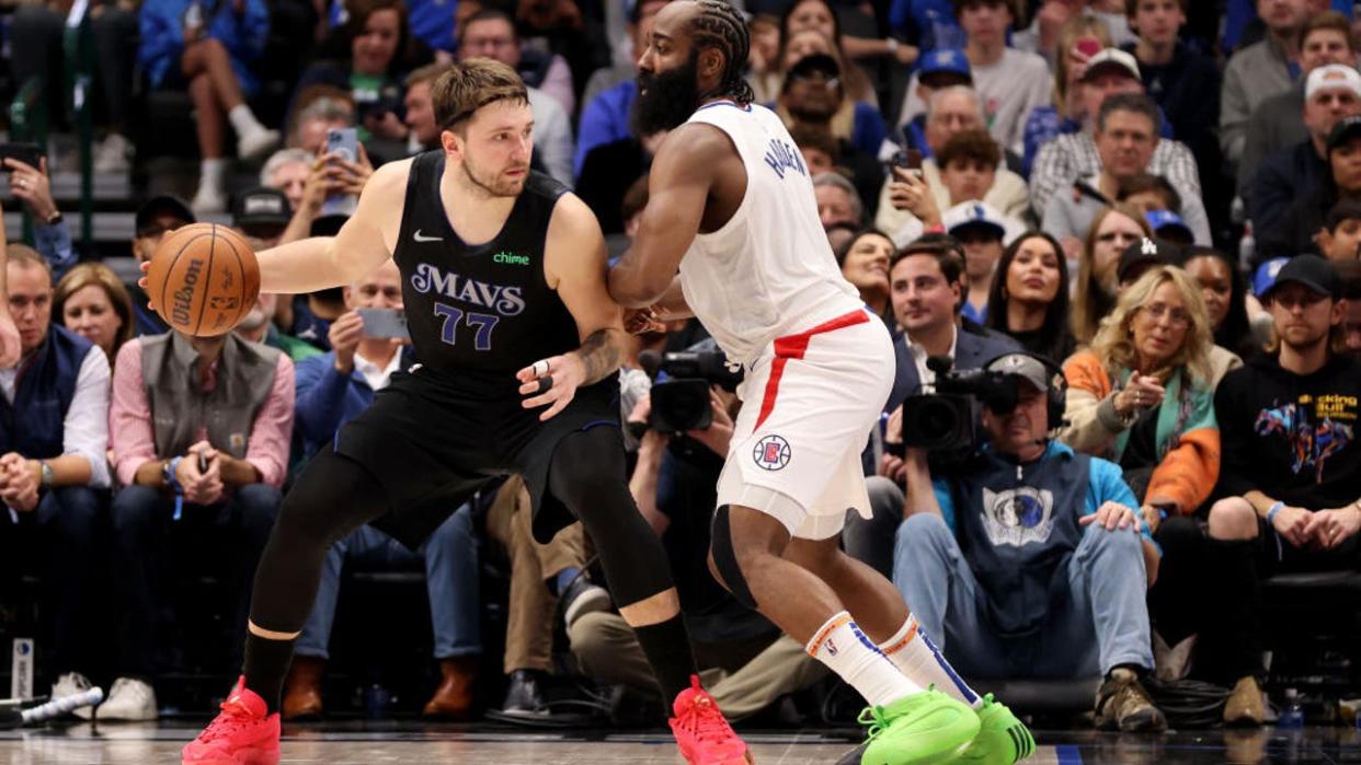 <div>DALLAS, TEXAS - DECEMBER 20: James Harden #1 of the LA Clippers guards Luka Doncic #77 of the Dallas Mavericks in the second half at American Airlines Center on December 20, 2023 in Dallas, Texas. (Photo by Tim Heitman/Getty Images)</div>