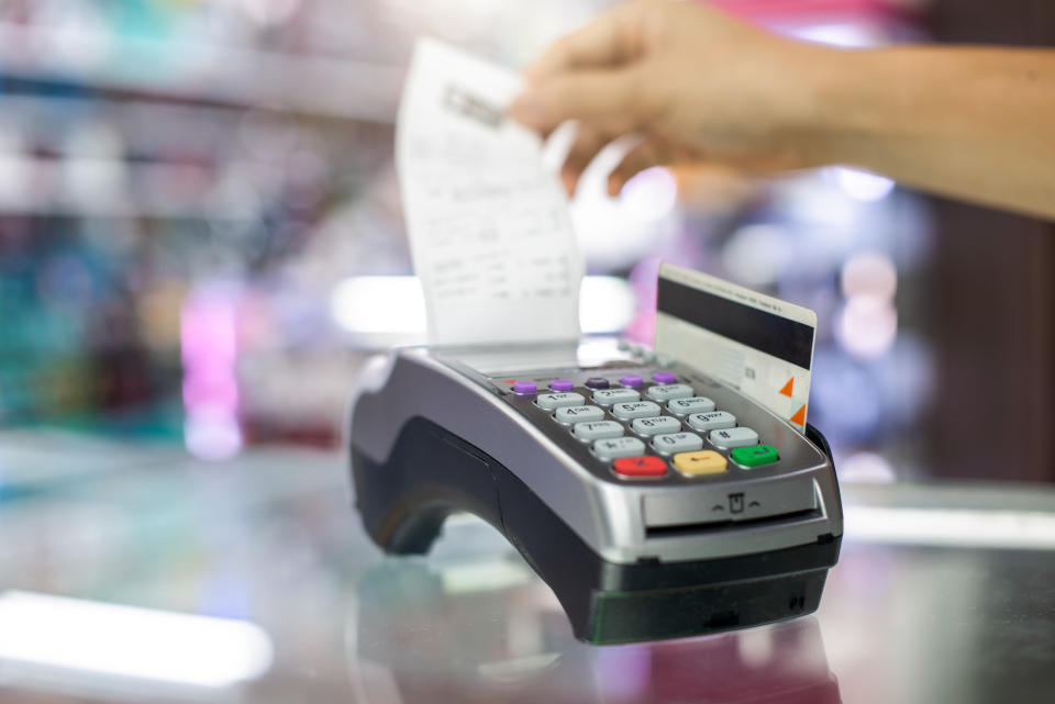 Card reading terminal with a receipt coming out