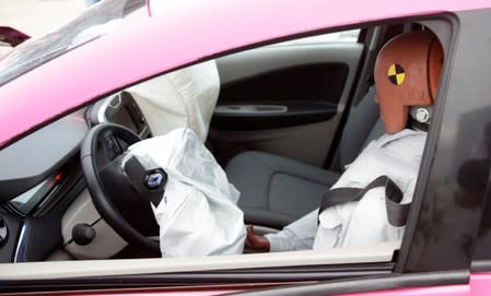 A crash test dummy is seen in the driver's seat of a Renault Zoe electric car after a controlled crash test from insurer AXA in Duebendorf