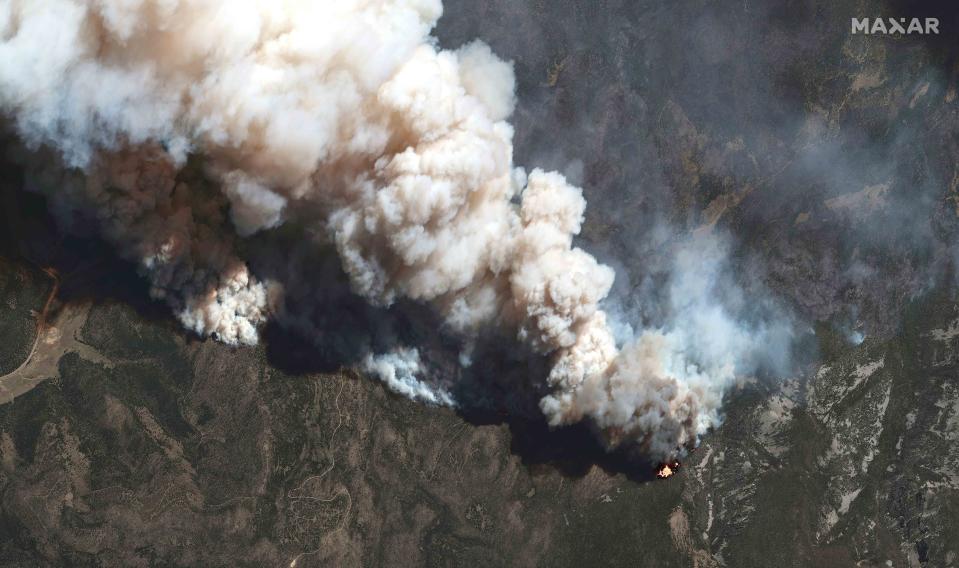 FILE - This satellite image provided by Maxar Technologies shows the active fire lines of the Hermits Peak wildfire, in Las Vegas, N.M., May 11, 2022. More than 5,000 firefighters are battling multiple wildland blazes in dry, windy weather across the Southwest. Evacuation orders remained in place Thursday, May 19, 2022, for residents near fires in Texas, Colorado and New Mexico. (Satellite image ©2022 Maxar Technologies via AP, File)