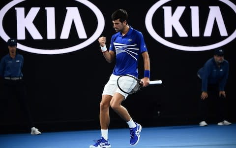 Serbia's Novak Djokovic reacts after a point against France's Jo-Wilfried Tsonga during their men's singles match on day four of the Australian Open tennis tournament in Melbourne on January 18, 2019 - Credit: AFP