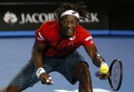 France's Gael Monfils hits a shot with his left hand during his quarter-final match against Canada's Milos Raonic at the Australian Open tennis tournament at Melbourne Park, Australia, January 27, 2016. REUTERS/Issei Kato