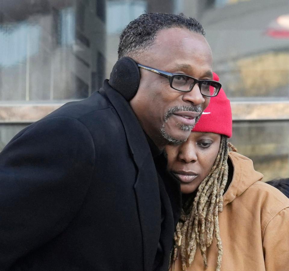 The Rev. Frederick V. LaMarr, pastor of Family Missionary Baptist Church supports Lakeya Cleveland — daughter of Michael Cleveland, 66, who was shot by Columbus police on Feb. 5 — during a press conference outside Columbus Police headquarters on Monday.