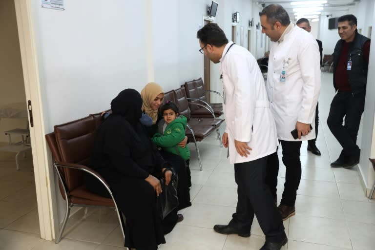 Safa al-Hussein brings her four-year-old daughter, Ahed, who was injured in an attack on the northern Syrian city of Raqa, to be treated by exiled Syrian doctors at a healthcare centre in the Turkish capital, Ankara