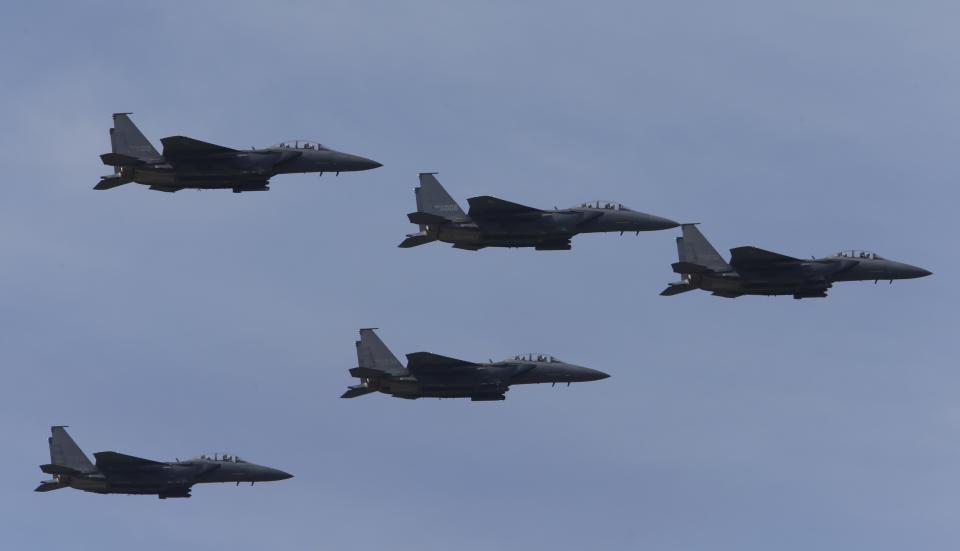 South Korean Air Force F-15K fighter jets fly in the sky during celebrations to mark the 65th anniversary of Korea Armed Forces Day, at a military airport in Seongnam, south of Seoul, October 1, 2013. (REUTERS/Kim Hong-Ji)