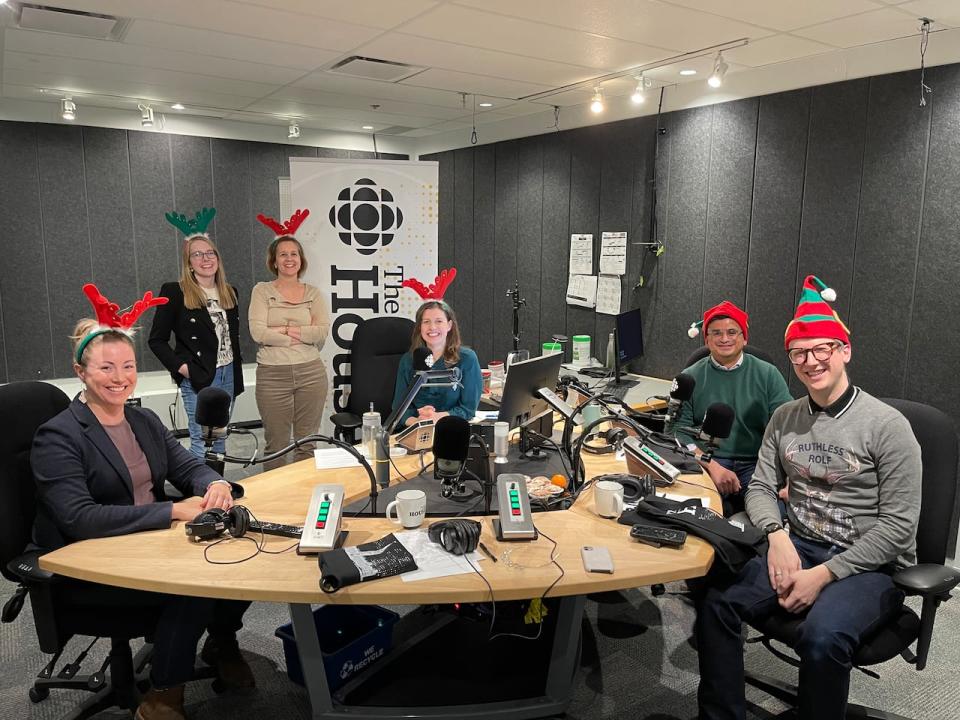 From left to right, participants and organizers of The House's 2023 year-end quiz show: Globe and Mail journalist Shannon Proudfoot, The House producer and quizmaster Emma Godmere, senior producer of The House Jennifer Chevalier, host Catherine Cullen, The Logic's Murad Hemmadi and Chris Nardi of the National Post.