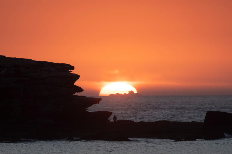 The sun rises over Bondi Beach in Sydney, Australia. 