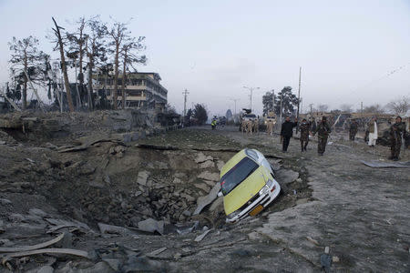 Afghan security forces and NATO troops arrive at the site of explosion near the German consulate office in Mazar-i-Sharif, Afghanistan November 11, 2016. REUTERS/Anil Usyan