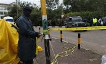 A Kenyan policeman secures the road past the Westgate Shopping Centre in the capital Nairobi, September 23, 2013. REUTERS/Thomas Mukoya