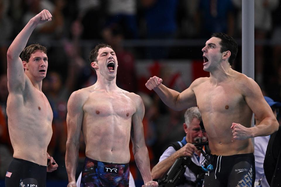 Gold medalists Caleb Dressel of the United States, Hunter Armstrong of the United States, Chris Juliano of the United States and Jack Alexie of the United States celebrate after the final of the men's 4x100m freestyle relay swimming event at the Paris La Defense Arena in Nanterre, west of Paris, on July 27, 2024. (Photo by SEBASTIEN BOZON/AFP) (Photo by SEBASTIEN BOZON/AFP via Getty Images)