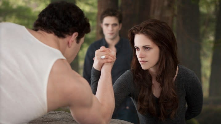 Kristen Stewart as Bella Sawn arm wrestling in Twilight Breaking Dawn Part 2.