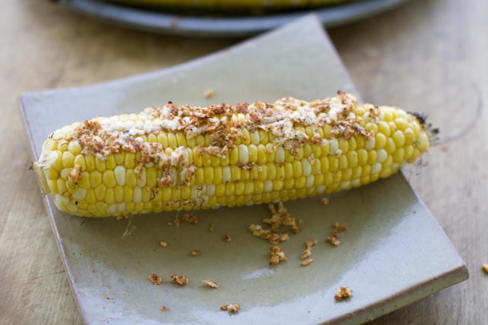 This July 15, 2013 photo shows grilled corn with queso fresco in Concord, N.H. (AP Photo/Matthew Mead)