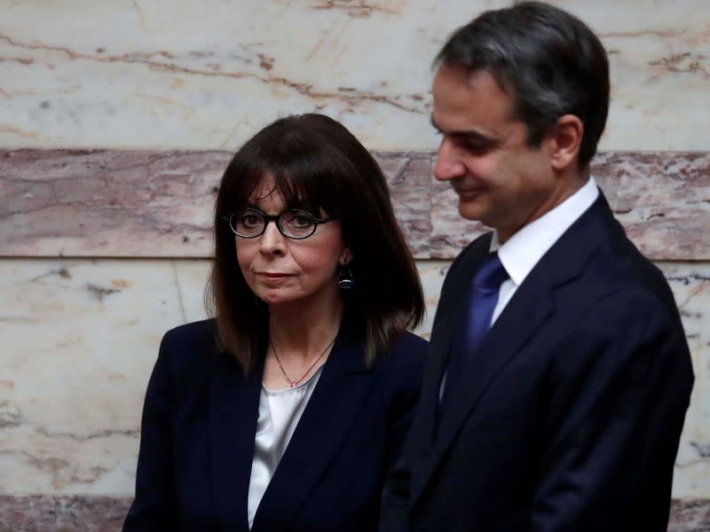 Newly elected Greek President Sakellaropoulou and Greece's PM Mitsotakis attend the swearing-in ceremony at the parliament in Athens