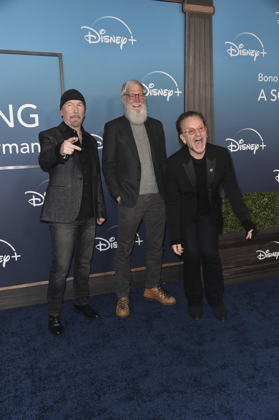 The Edge, from left, David Letterman and Bono arrive at the premiere of "Bono & The Edge: A Sort of Homecoming, With Dave Letterman" on Wednesday, March 8, 2023, at The Orpheum Theatre in Los Angeles. (Photo by Richard Shotwell/Invision/AP)