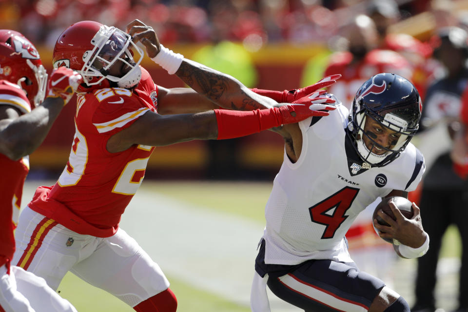 Houston Texans quarterback Deshaun Watson (4) is tackled by Kansas City Chiefs cornerback Kendall Fuller (29) during the first half of an NFL football game in Kansas City, Mo., Sunday, Oct. 13, 2019. (AP Photo/Colin E. Braley)