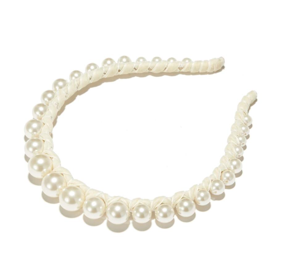 Get <a href="https://www.lelesadoughi.com/products/ivory-graduated-pearl-velvet-strand-headband?variant=35789169983650&amp;currency=USD&amp;utm_medium=product_sync&amp;utm_source=google&amp;utm_content=sag_organic&amp;utm_campaign=sag_organic&amp;gclid=Cj0KCQiA962BBhCzARIsAIpWEL3T_xORszUIAsUVmkZvvjcnmkGFoHAHrs9FGXbpsP2DdUrnJ880Ge0aAiaGEALw_wcB" target="_blank" rel="noopener noreferrer">the Lele Sadoughi ivory graduated pearl velvet strand headband for $115</a>.