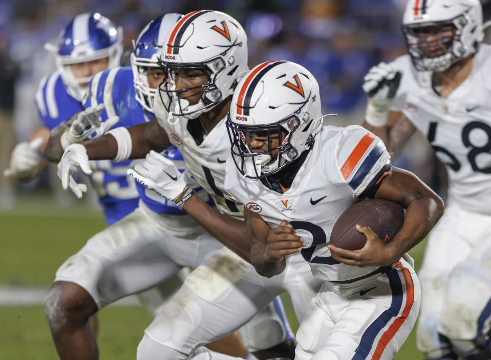 Virginia's Perris Jones (2) carries the ball during the first half of the team's NCAA college football game against Duke in Durham, N.C., Saturday, Oct. 1, 2022. (AP Photo/Ben McKeown)