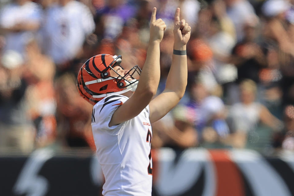 FILE - Cincinnati Bengals kicker Evan McPherson (2) points skyward after making a field goal from over 50 yards against the Minnesota Vikings during the second half of an NFL football game, Sunday, Sept. 12, 2021, in Cincinnati. While its Super Bowl commercial appearances are few, religion – Christianity especially – is entrenched in football culture.(AP Photo/Aaron Doster, File)
