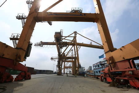 Cranes damaged by air strikes are pictured at the port of Hodeida, Yemen April 1, 2018. Picture taken April 1, 2018. REUTERS/Abduljabbar Zeyad