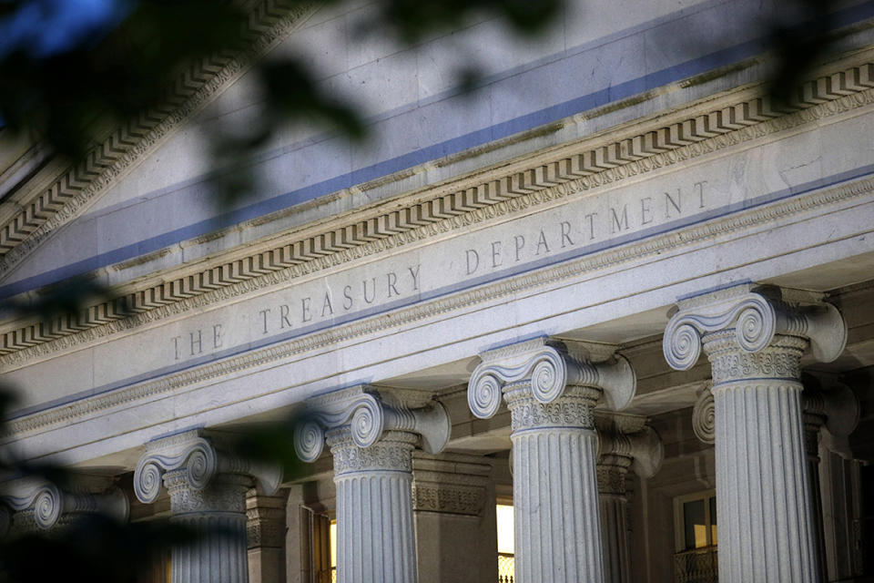 FILIE - This June 6, 2019, file photo shows the U.S. Treasury Department building at dusk in Washington. Multiple published reports say that the U.S. government has launched a national-security review of the China-owned video app TikTok, popular with millions of U.S. teens and young adults. Several senators have recently noted concerns about censorship and data collection on TikTok. The Treasury Department, which houses CFIUS, says it does not comment on specific cases. (AP Photo/Patrick Semansky, File)