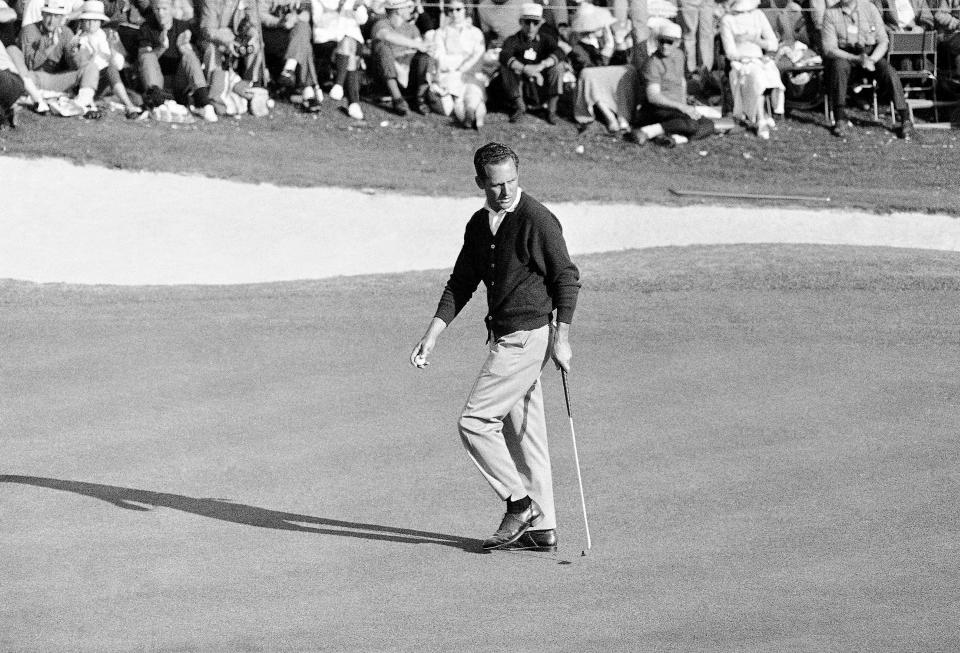Tommy Jacobs looks back at the cup on the 18th green after holing out with a par 288 in final round of the Masters Golf Tournament at Augusta National Golf Club, April 10, 1966.