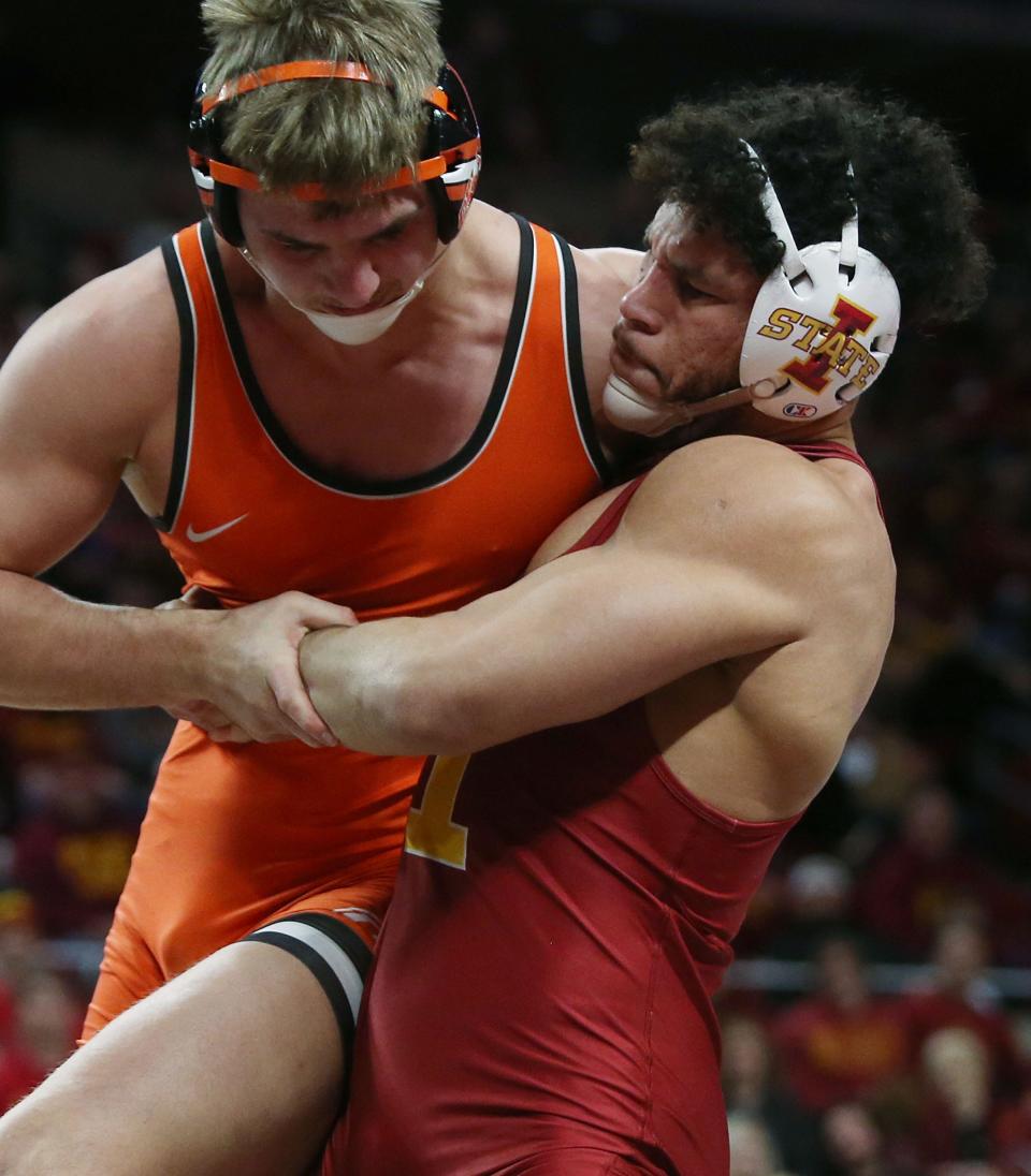 Iowa State Cyclones Yonger Bastida takes down Oklahoma State Cowboys Luke Surber during their 197-pound wrestling in a dual meet at Hilton Coliseum Sunday, Jan. 29, 2023, in Ames, Iowa.